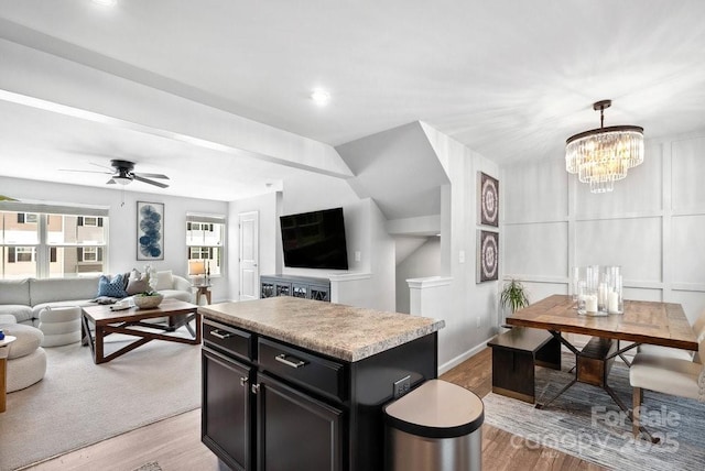 999 Rushing Ln Unit 13, Fort Mill, SC 29715 - kitchen featuring open floor plan, light wood-style floors, dark cabinetry, and a center island