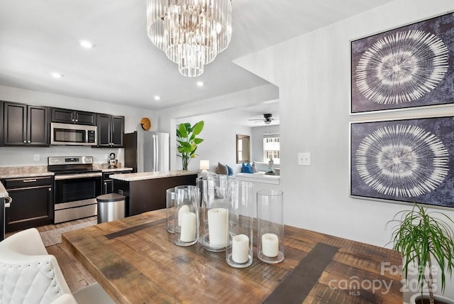 999 Rushing Ln Unit 13, Fort Mill, SC 29715 - dining space with recessed lighting, a chandelier, light wood finished floors, and a ceiling fan