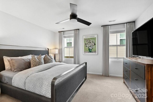 999 Rushing Ln Unit 13, Fort Mill, SC 29715 - bedroom with multiple windows, light colored carpet, and a ceiling fan