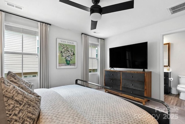 999 Rushing Ln Unit 13, Fort Mill, SC 29715 - bedroom with wood finished floors, ceiling fan, and ensuite bathroom