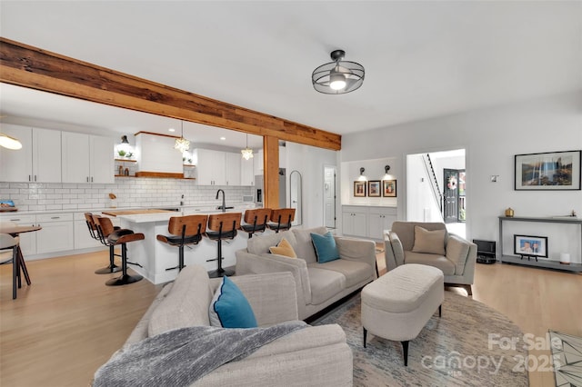 15737 Agincourt Dr, Huntersville, NC 28078 - living area with light wood finished floors and beamed ceiling