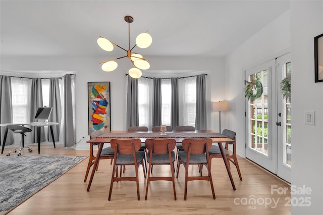 15737 Agincourt Dr, Huntersville, NC 28078 - dining area with light wood-type flooring and a chandelier
