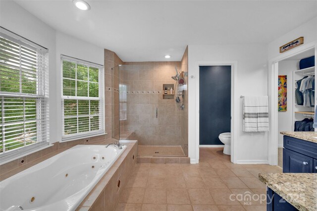 15737 Agincourt Dr, Huntersville, NC 28078 - bathroom featuring a stall shower, a jetted tub, tile patterned floors, vanity, and recessed lighting