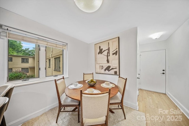201 N Dotger Ave Unit C8, Charlotte, NC 28207 - dining space with baseboards and light wood-style flooring