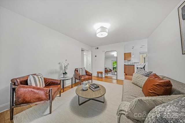 201 N Dotger Ave Unit C8, Charlotte, NC 28207 - living area featuring arched walkways and light wood-type flooring