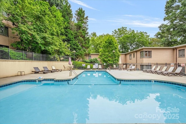 201 N Dotger Ave Unit C8, Charlotte, NC 28207 - community pool with a patio and view of scattered trees