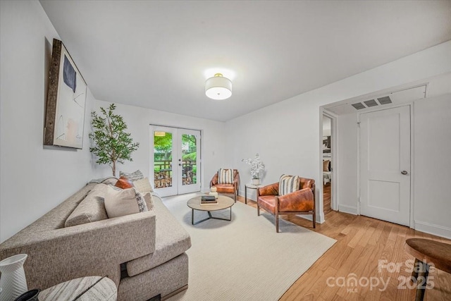 201 N Dotger Ave Unit C8, Charlotte, NC 28207 - living area with light wood finished floors and french doors