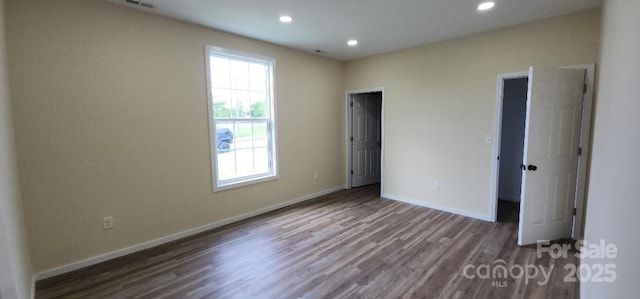 306 E Ratchford Ave, Gastonia, NC 28054 - unfurnished bedroom with wood finished floors, recessed lighting, and baseboards