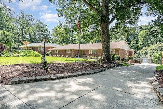 5424 Doncaster Dr, Charlotte, NC 28211 - single story home featuring an outbuilding, brick siding, a front yard, and concrete driveway