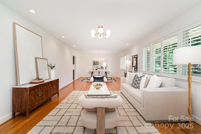 5424 Doncaster Dr, Charlotte, NC 28211 - living room featuring a chandelier, light wood-style flooring, and recessed lighting