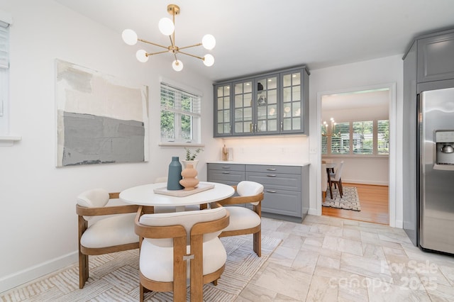 5424 Doncaster Dr, Charlotte, NC 28211 - dining room with a chandelier and baseboards