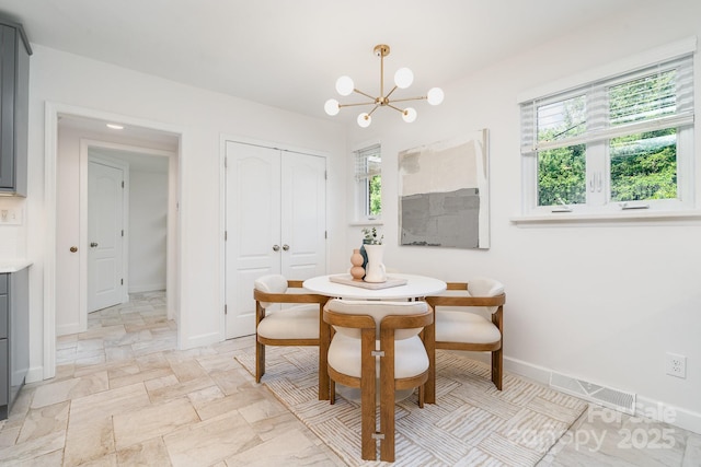 5424 Doncaster Dr, Charlotte, NC 28211 - dining area with a chandelier and baseboards