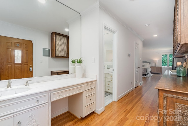 5424 Doncaster Dr, Charlotte, NC 28211 - bathroom featuring ornamental molding, wood finished floors, vanity, and recessed lighting