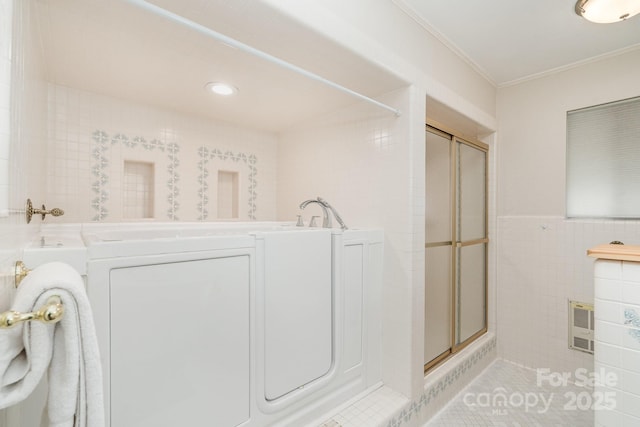 5424 Doncaster Dr, Charlotte, NC 28211 - full bathroom featuring tile walls, a stall shower, crown molding, tile patterned flooring, and recessed lighting