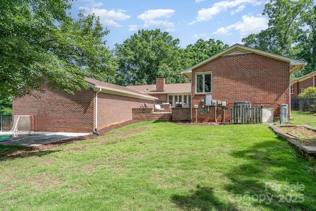 5424 Doncaster Dr, Charlotte, NC 28211 - back of property with brick siding and a chimney