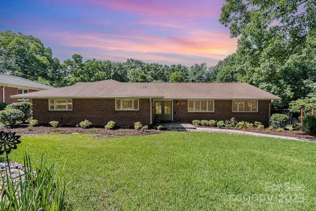 5424 Doncaster Dr, Charlotte, NC 28211 - ranch-style house with french doors, a front yard, and brick siding