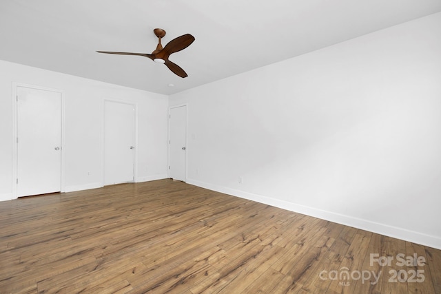 10101 Wood Ct, Charlotte, NC 28277 - unfurnished bedroom with wood finished floors and a ceiling fan