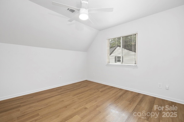 10101 Wood Ct, Charlotte, NC 28277 - bonus room featuring lofted ceiling, wood finished floors, and a ceiling fan