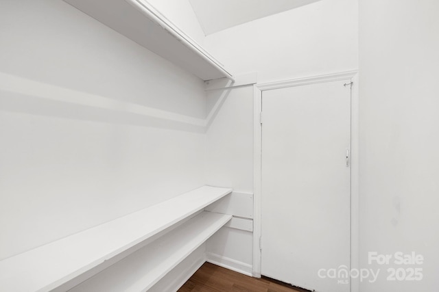 10101 Wood Ct, Charlotte, NC 28277 - walk in closet featuring dark wood finished floors