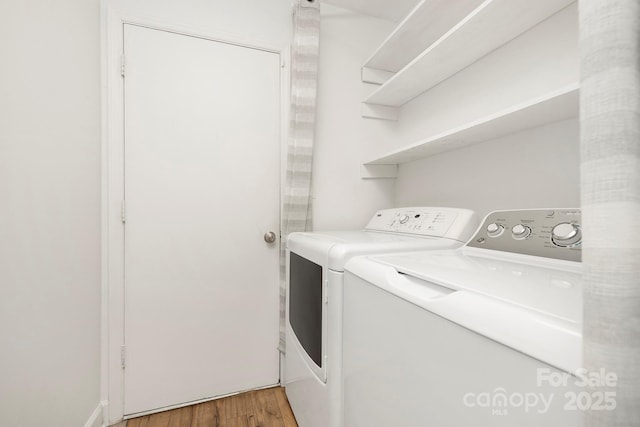 10101 Wood Ct, Charlotte, NC 28277 - laundry area featuring washing machine and clothes dryer and light wood-style flooring