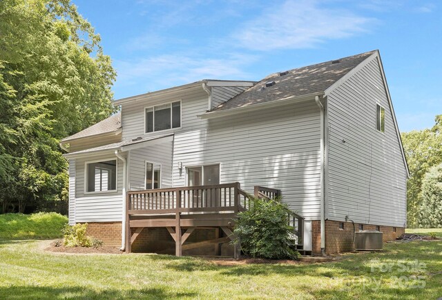 10101 Wood Ct, Charlotte, NC 28277 - rear view of house with a wooden deck, a yard, and a shingled roof