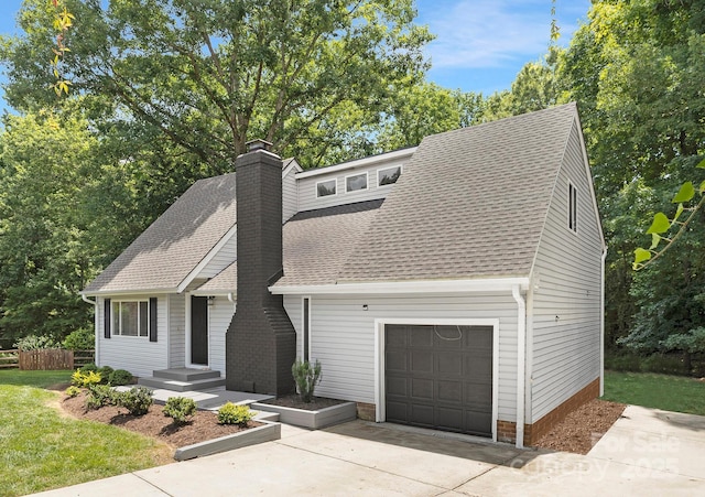 10101 Wood Ct, Charlotte, NC 28277 - view of front of home featuring a chimney, a shingled roof, driveway, and a garage