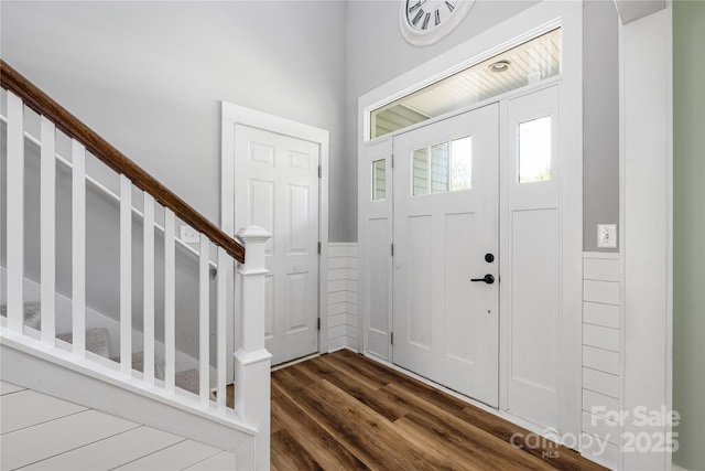 3902 Mcgee Point Rd, Terrell, NC 28682 - entrance foyer with dark wood finished floors, stairway, and wainscoting