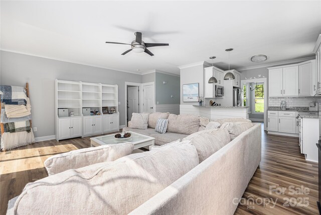 3902 Mcgee Point Rd, Terrell, NC 28682 - living room featuring ceiling fan, dark wood-style floors, and ornamental molding