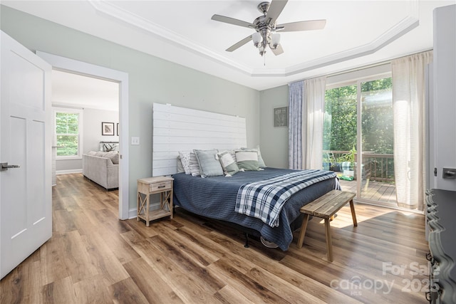 3902 Mcgee Point Rd, Terrell, NC 28682 - bedroom featuring a tray ceiling, light wood-style floors, crown molding, access to outside, and ceiling fan