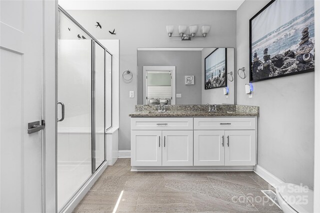 3902 Mcgee Point Rd, Terrell, NC 28682 - full bathroom with baseboards, a shower stall, and double vanity