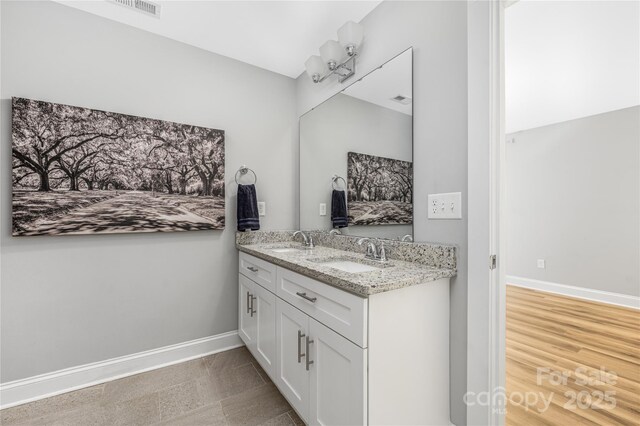 3902 Mcgee Point Rd, Terrell, NC 28682 - full bathroom featuring double vanity and baseboards