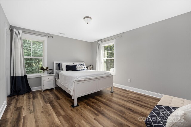 3902 Mcgee Point Rd, Terrell, NC 28682 - bedroom with dark wood-style floors and baseboards