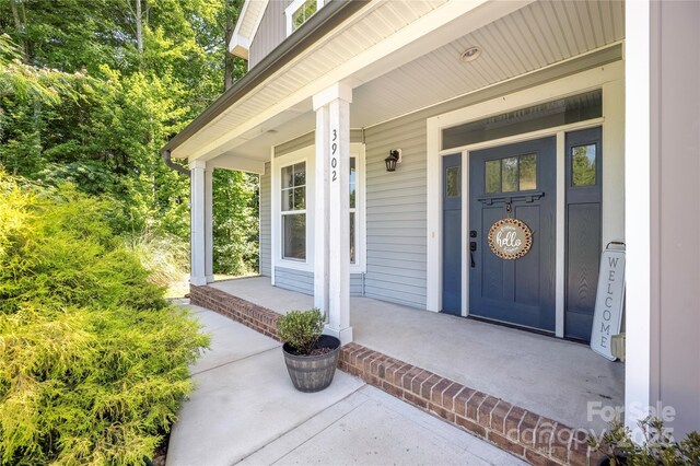 3902 Mcgee Point Rd, Terrell, NC 28682 - view of exterior entry with a porch
