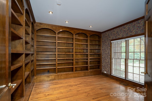 4672 Snow Dr, Harrisburg, NC 28075 - unfurnished room with wallpapered walls, crown molding, wood finished floors, baseboards, and recessed lighting
