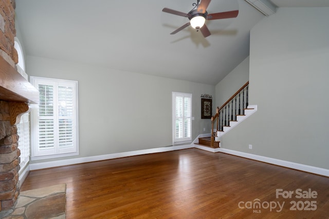 4672 Snow Dr, Harrisburg, NC 28075 - unfurnished living room featuring wood finished floors, plenty of natural light, baseboards, and ceiling fan
