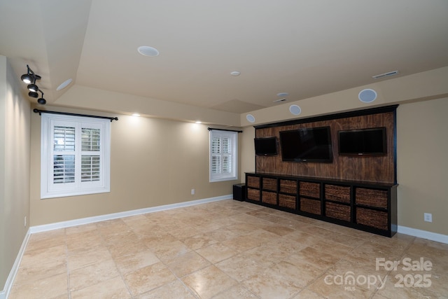 4672 Snow Dr, Harrisburg, NC 28075 - unfurnished living room featuring baseboards and light stone finish floors
