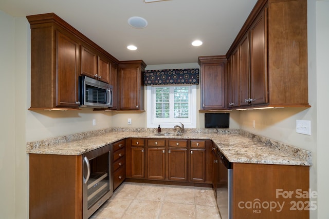 4672 Snow Dr, Harrisburg, NC 28075 - kitchen with wine cooler, stainless steel appliances, a sink, light stone counters, and recessed lighting