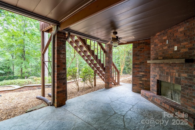 4672 Snow Dr, Harrisburg, NC 28075 - view of patio / terrace with an outdoor brick fireplace, stairs, and ceiling fan