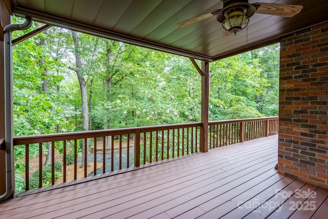 4672 Snow Dr, Harrisburg, NC 28075 - wooden deck featuring ceiling fan and a wooded view