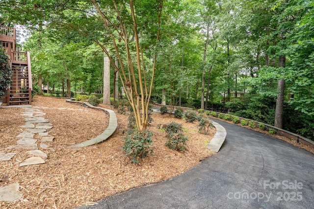 4672 Snow Dr, Harrisburg, NC 28075 - view of yard featuring stairs and view of scattered trees