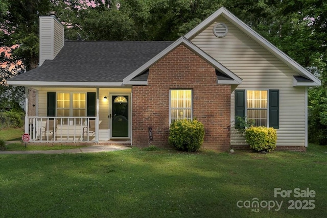 209 Mcfadden St, Rock Hill, SC 29730 - view of front of home featuring covered porch, a chimney, a front yard, and brick siding