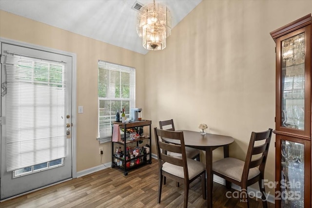 209 Mcfadden St, Rock Hill, SC 29730 - dining space featuring a chandelier, wood finished floors, and healthy amount of natural light