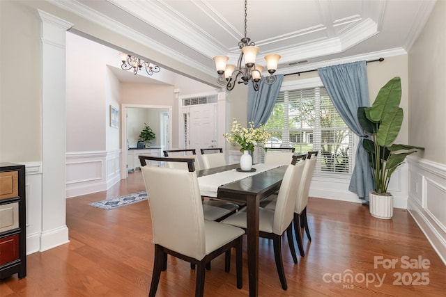 10106 Silverling Dr, Waxhaw, NC 28173 - dining room with a chandelier, a decorative wall, ornamental molding, dark wood-type flooring, and a wainscoted wall