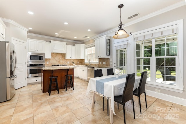 10106 Silverling Dr, Waxhaw, NC 28173 - dining area with ornamental molding, light tile patterned flooring, and recessed lighting
