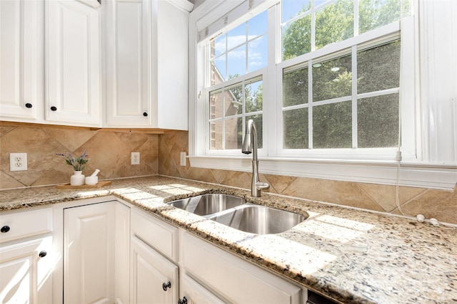 10106 Silverling Dr, Waxhaw, NC 28173 - kitchen featuring white cabinetry, backsplash, and light stone countertops