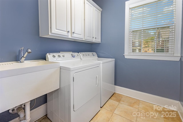 10106 Silverling Dr, Waxhaw, NC 28173 - laundry area featuring cabinet space, washer and clothes dryer, and light tile patterned floors