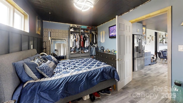751 Northbrook Iii School Rd, Vale, NC 28168 - bedroom with stainless steel fridge with ice dispenser, wood finished floors, and a closet