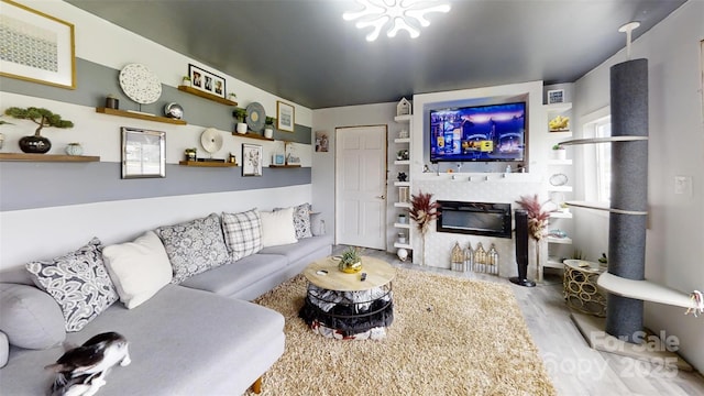 751 Northbrook Iii School Rd, Vale, NC 28168 - living room with a glass covered fireplace and wood finished floors