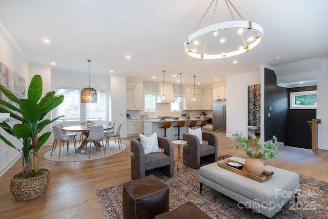 4203 Walker Rd, Charlotte, NC 28211 - living room featuring light wood-type flooring, a chandelier, and recessed lighting