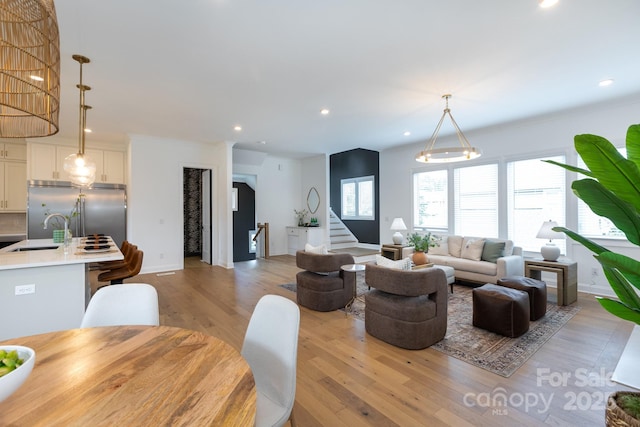 4203 Walker Rd, Charlotte, NC 28211 - living area with light wood-style flooring, stairs, and recessed lighting